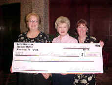 Editor Terry Mathews, National Breast Cancer Foundation President Janelle Hail, Editor Alison Demasters - the first contribution of $1000. 